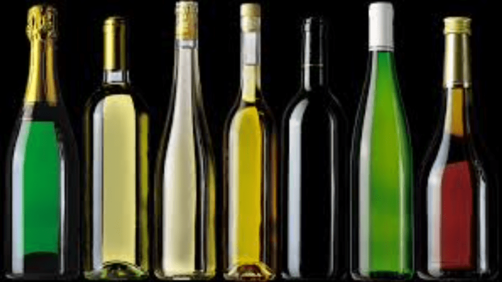 row of bottles - no labels, various colours